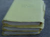 Photo of three yellow manilla folders, somewhat dogeared: volumes 1 to 3